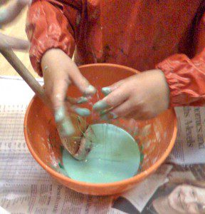 Playing with paint at Creche